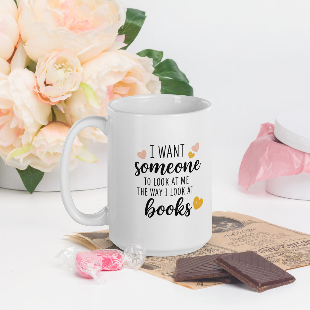 White mug front: “I want someone… books” text with heart icons