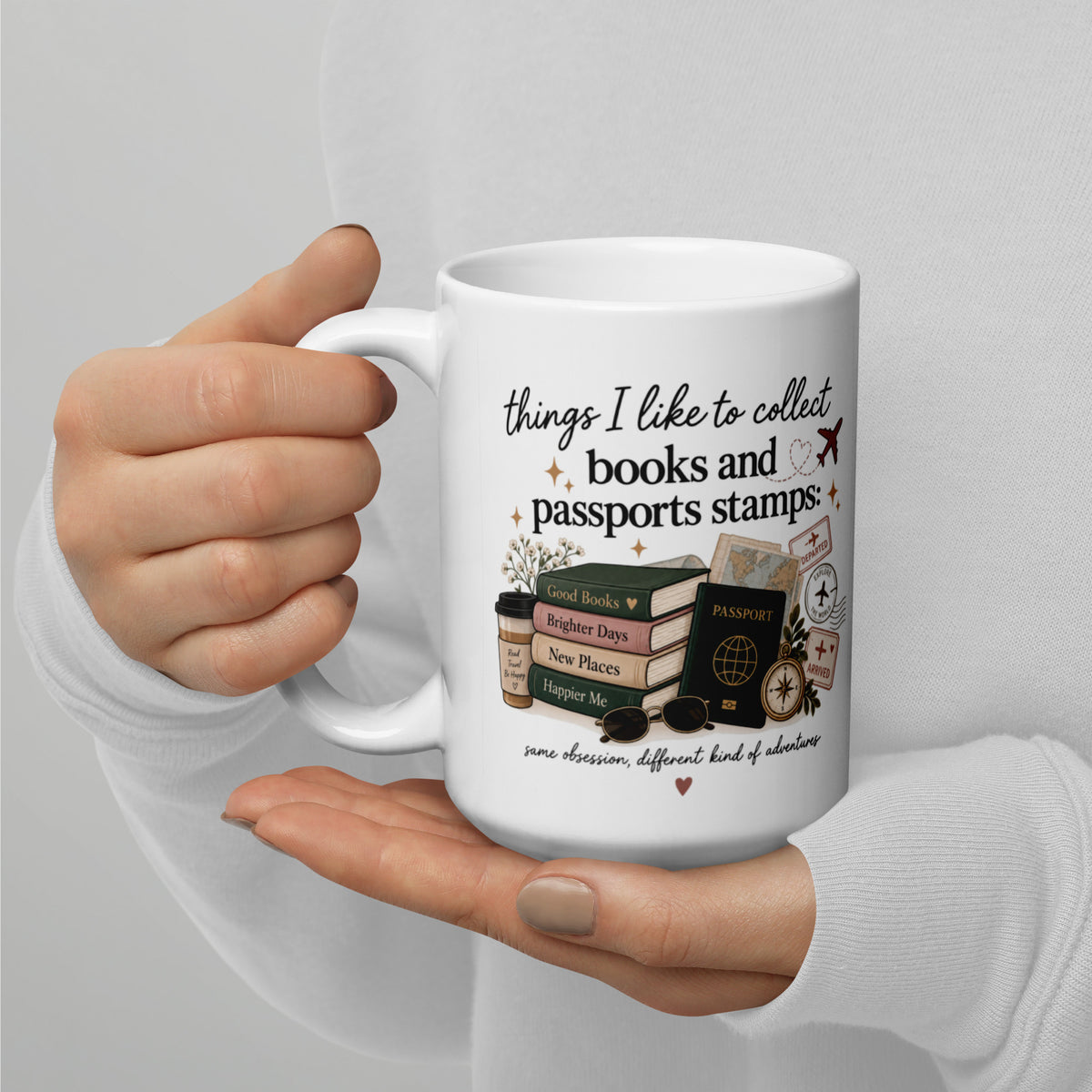 White mug, front view, 'books and passports stamps' travel stamp graphic