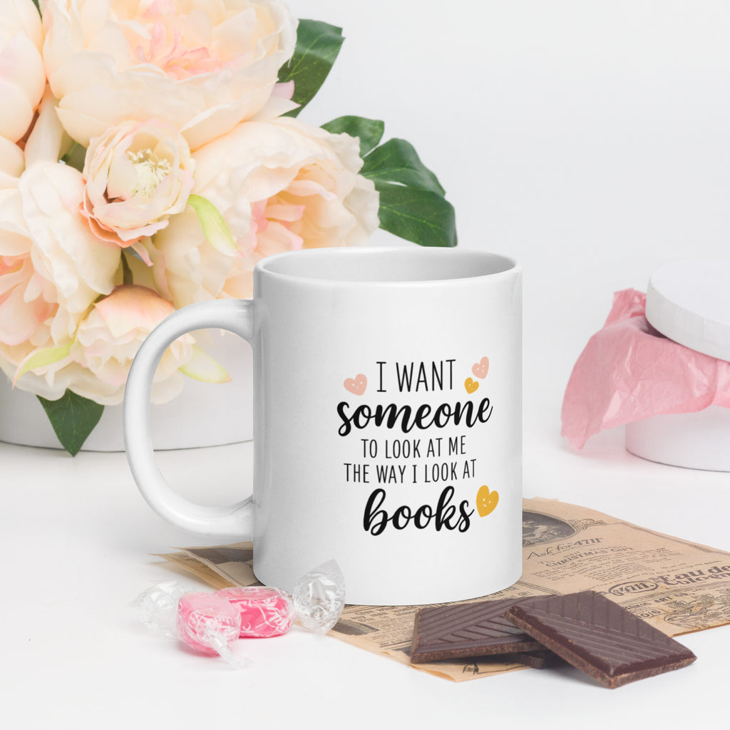 White mug: “I want someone… books” text with heart icons