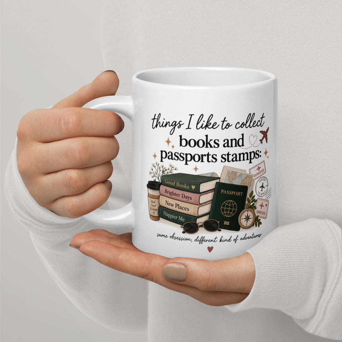 White mug with 'books and passports stamps' travel stamp graphic
